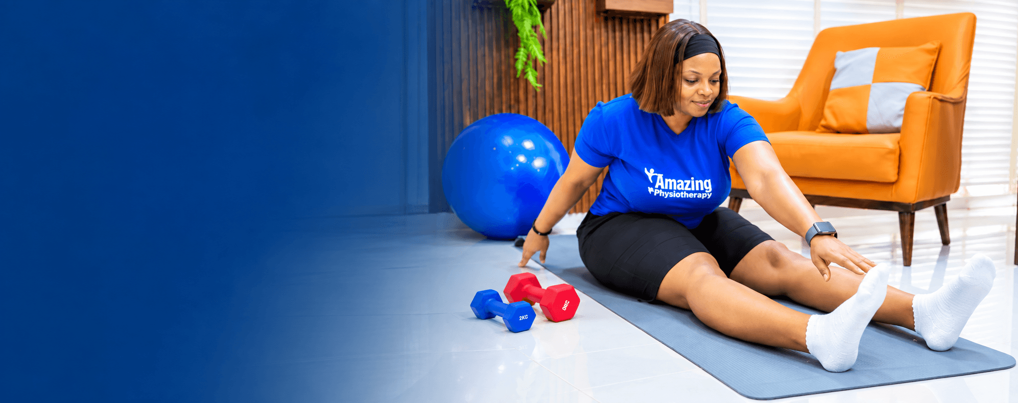 Amazing Physiotherapy specialist stretching while seated on the floor
